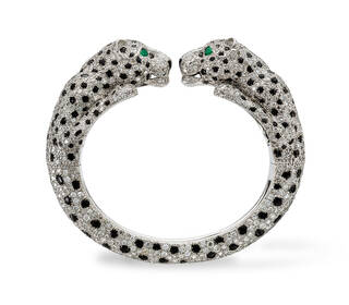 Bracelet encrusted with diamonds and black stones with two panther heads