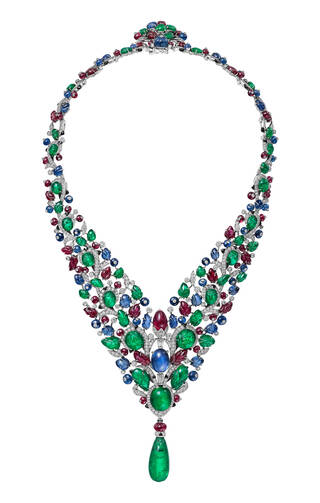 multi-coloured necklace encrusted with gems and large green drop stone at the bottom
