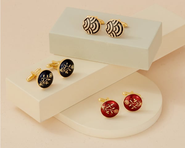 Cufflinks - Jewellery for him Three pairs of cufflinks propped up on plinths.