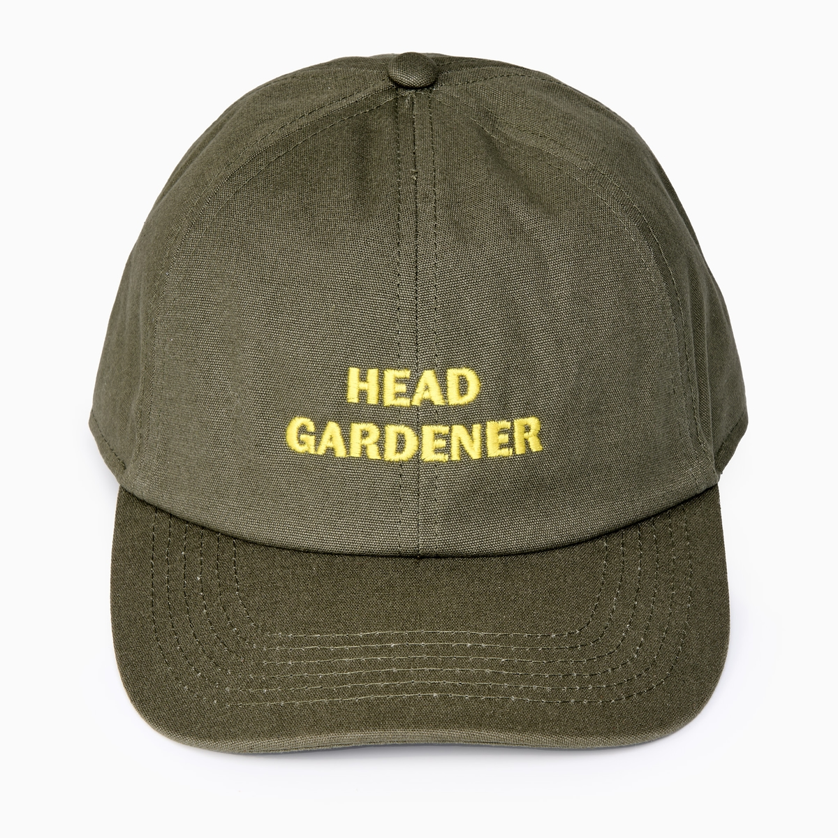A green cap with 'head gardener' text on it,