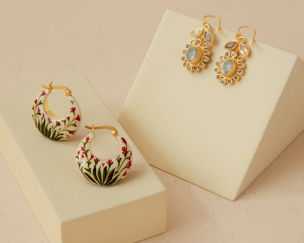 Jewellery inspired by nature Two pairs of earrings with floral motifs.