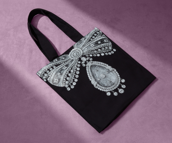 V&A Cartier exhibition Black tote bag with a printed jewel in the shape of a bow.