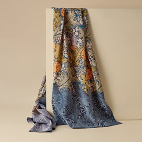 Scarves A silk scarf featuring an floral patter in a blue gray background